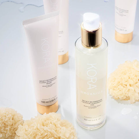 Milky Mushroom products on a glass surface with silver ear mushrooms placed here & there. 