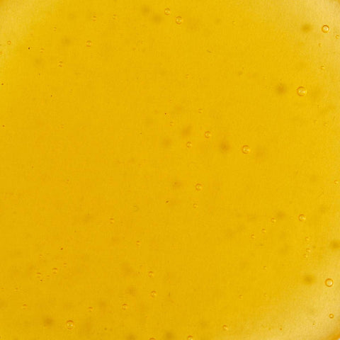 Swatch of Noni Radiant Eye Oil - golden yellow tint. 