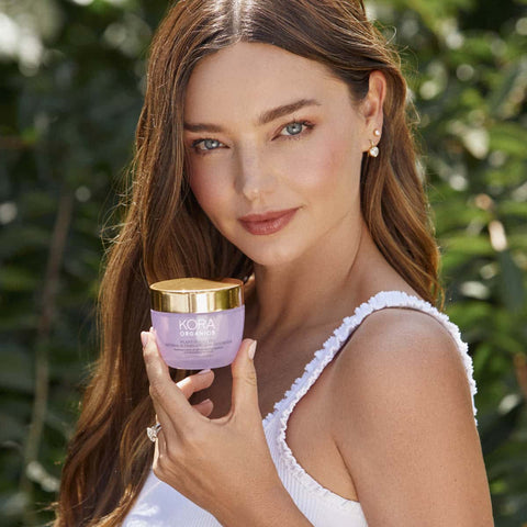 Miranda Kerr holding Plant Stem Cell Retinol Alternative Moisturizer 50ml jar.
