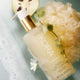 Kora Organics hand and body wash with a floral and natural elements on a light background.