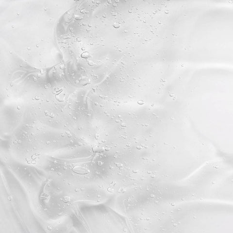 Swatch of KORA Organics renewing hand & body wash - clear gel texture. 