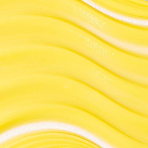 Swatch of Turmeric Glow Moisturizer - yellow creamy texture.