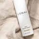 LAMAV Daily Vitamin C Serum bottle on a textured beige fabric background