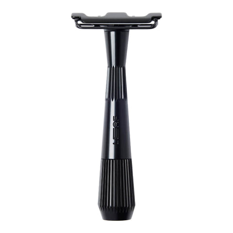 Black safety razor on a white background