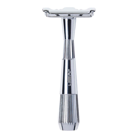 Silver safety razor on a white background