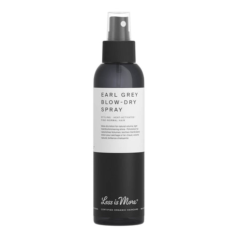 Black bottle of Earl Grey Blow-Dry Spray with a white label on a white background