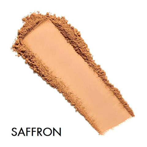 Saffron-colored makeup swatch on a white background