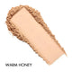 Cosmetic powder sample with 'Warm Honey' label on a white background