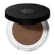 Compact brown pressed eye shadow in a white case with a black lid on a white background