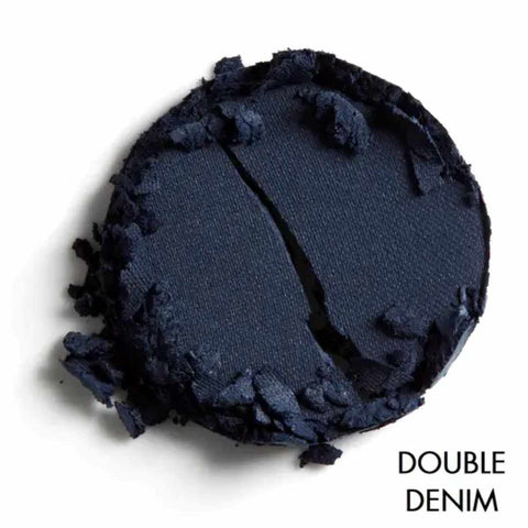 Navy blue makeup shade with textured edges on a white background, labeled 'Double Denim'.