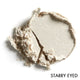 Close-up of pale glittery beige pressed eye shadow with 'Starry Eyed' text on a white background