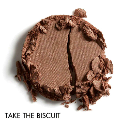 Brown pressed eye shadow on a white background, in the shade - 'Take the Biscuit'.