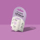 A package of Little Urchin Lip Balm in Cherry & Kakadu Plum, shown at an angle with its cardboard hanger card against a solid purple background.