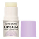 A stick of Little Urchin Lip Balm with its cap removed, showing the pale yellow balm stick and a lavender purple cap placed beside it on a white background.