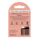 Back of a lip balm package in a dusty pink card-style shape with a die-cut hanging tab. The card shows product information, ingredients, icons, and a barcode.