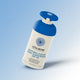 A bottle of Little Urchin Natural Clear Zinc Sunscreen SPF 50 on a light blue gradient background. The bottle is white with a blue cap and blue text.