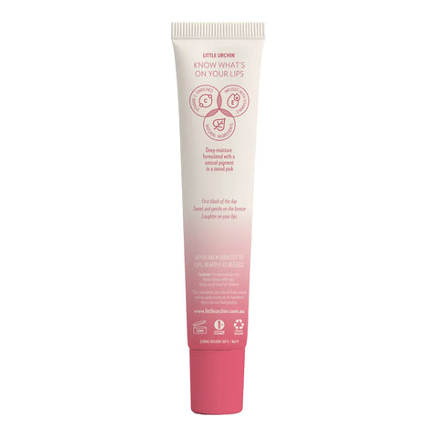 Back of tube of strawberry lip balm, featuring a pink gradient at the bottom, with pink text and icons.
