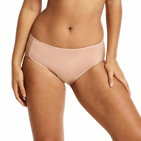 Beige bikini bottom worn by a person on a white background