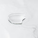 Clear liquid on a reflective surface.