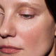 Close-up of a person's eye and cheek.