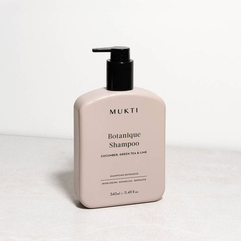 Mukti Botanique Shampoo bottle on a light gray background