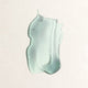 Swatch of blue gel-like hyaluronic marine serum on a neutral background.