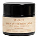 A black cosmetic jar of Mukti Queen of the Night Crème with a beige label, shown on a plain white background.