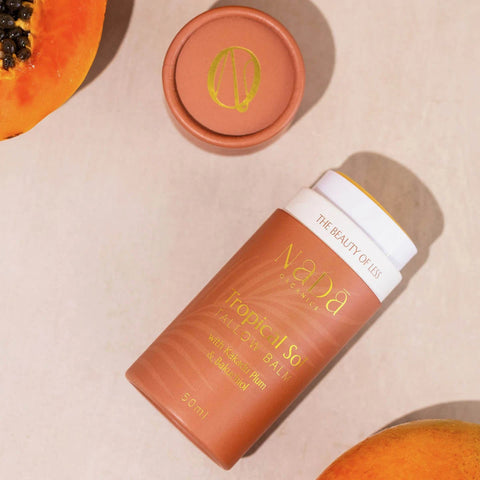 Nada Organics Tropical Sol product with a papaya on a beige background.