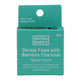 Teal package of Noosa Basics dental floss with bamboo charcoal on a white background
