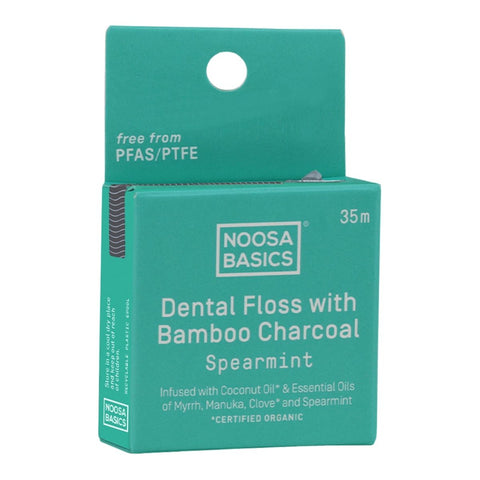 Teal box of Noosa Basics dental floss with bamboo charcoal on a white background