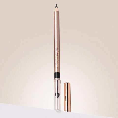 Makeup pencil with cap on a light beige background.