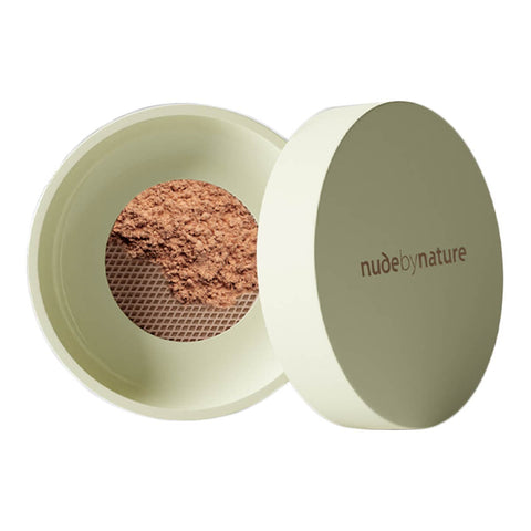 Green 10g container of Nude By Nature Natural Mineral Cover Blemish Control in shade medium. White background. 