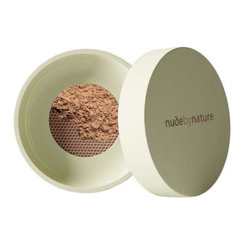 Green 10g container of Nude By Nature Natural Mineral Cover Blemish Control in shade tan. White background. 