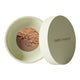 Green 10g container of Nude By Nature Natural Mineral Cover Blemish Control in shade tan. White background. 