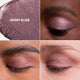 Close-up of Berry Bliss eyeshadow on skin with swatch and close-up of eye.
