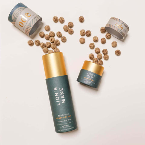 Ode Health Lion's Mane honey pearls 21 pearl pack and 90 pearl pack. Pearls spilling out on a white background. 