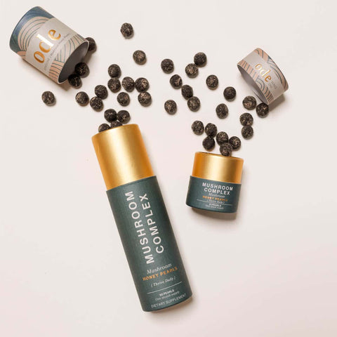 Ode Health Mushroom Complex honey pearls 21 pearl pack and 90 pearl pack. Pearls spilling out on a white background. 