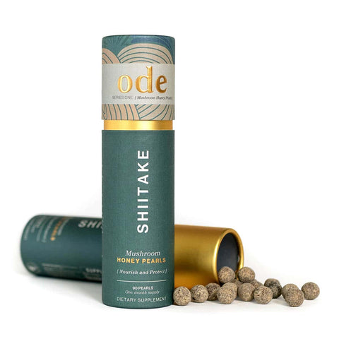 Shiitake mushroom honey pearls packaging with open lid on a white background.