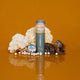 Ode Health Tremella Mushroom Honey Pearls on an orange background with mushrooms & honeycomb. 