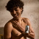 Man holding Papermoon Clean Deodorant - Aloe & Agave 75g product.