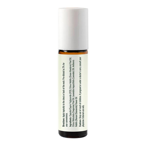 Back of calming the child essential oil roll-on blend with usage instructions & ingredients. 