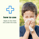 Child blowing their nose with a tissue with how to use info.