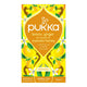 Pukka lemon, ginger, and manuka honey tea packaging on a white background.