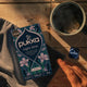 Pukka Herbs Night Time tea box next to a brewing cup of night time tea.