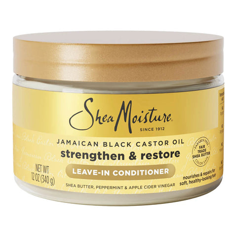 Shea Moisture Jamaican Black Castor Oil leave-in conditioner in a 12 oz jar with a gold lid and gold label, on a white background.