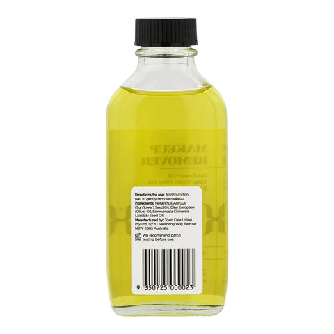 Bottle of yellow liquid with a black cap on a white background