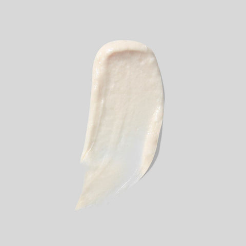 Calming face and neck moisturiser on a grey background. Creamy texture.