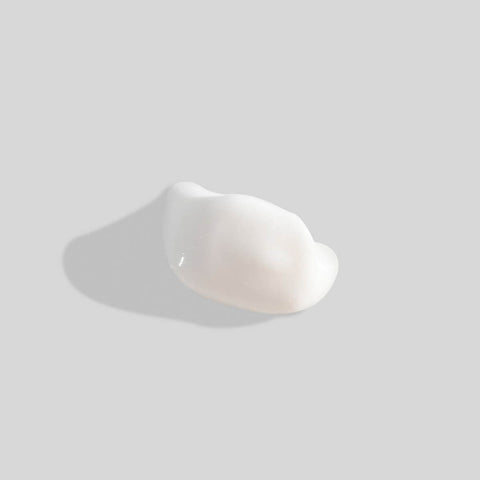 Swatch of eye and lip smoother on a grey background. 