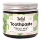 Jar of Solid Toothpaste Fresh Mint with Fluoride on a white background