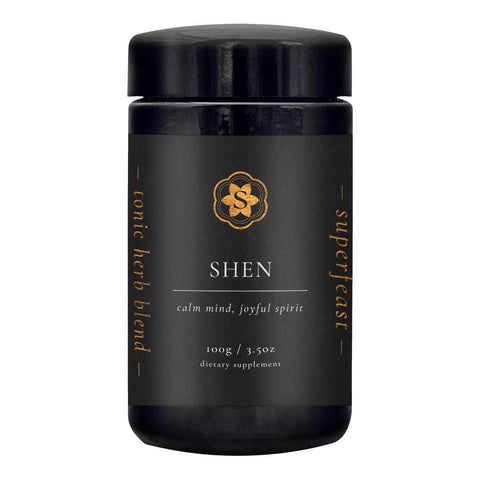 Black container of Shen tonic herb blend with gold text on a white background
